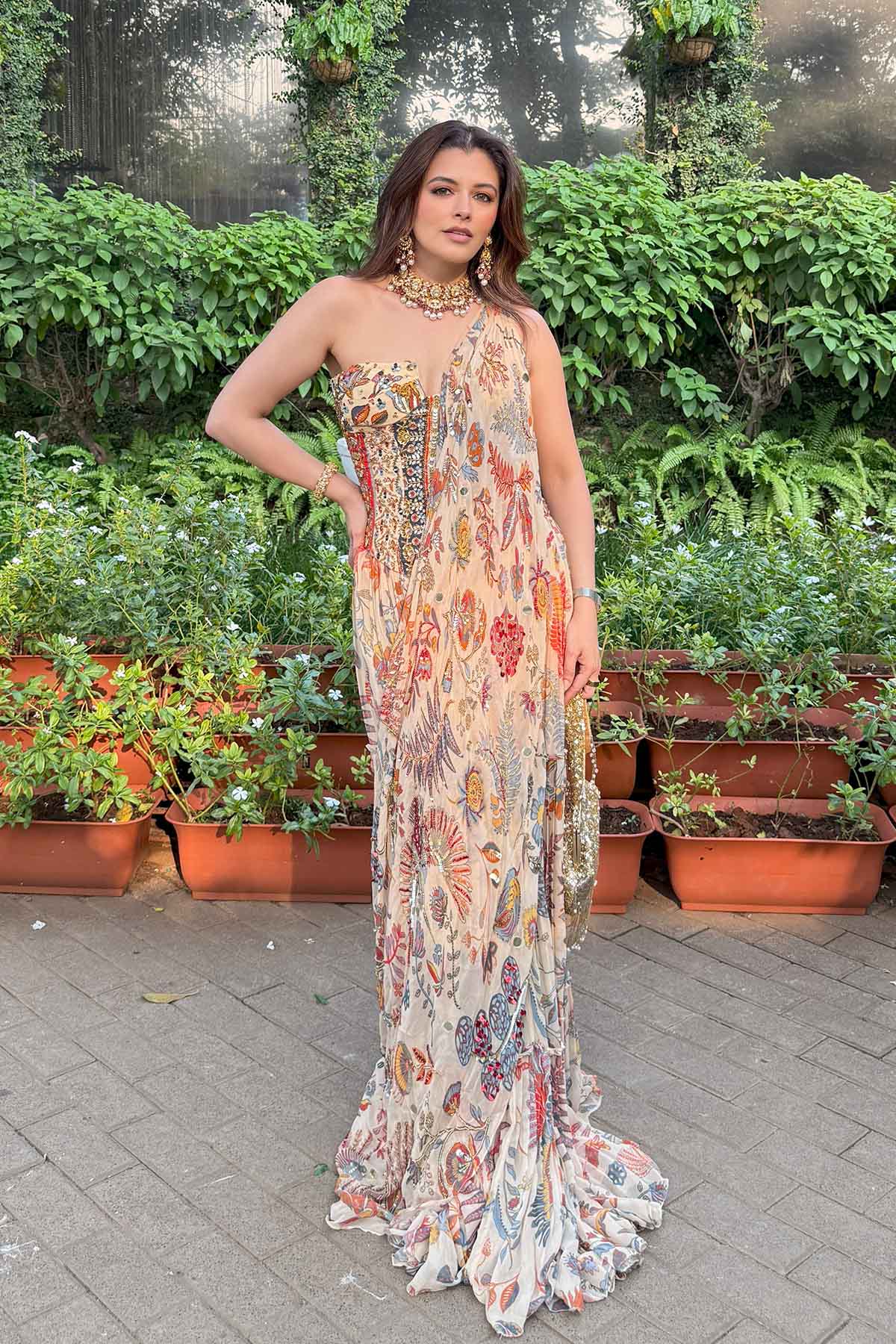 Natasha Luthra In Beige Printed And Highlighted Corset With Tiered Skirt Saree Set