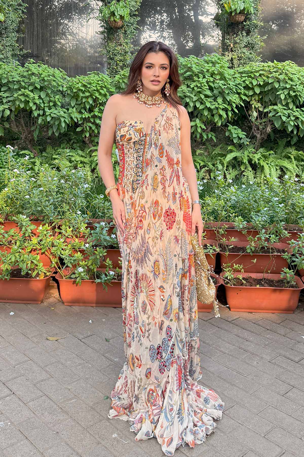 Natasha Luthra In Beige Printed And Highlighted Corset With Tiered Skirt Saree Set