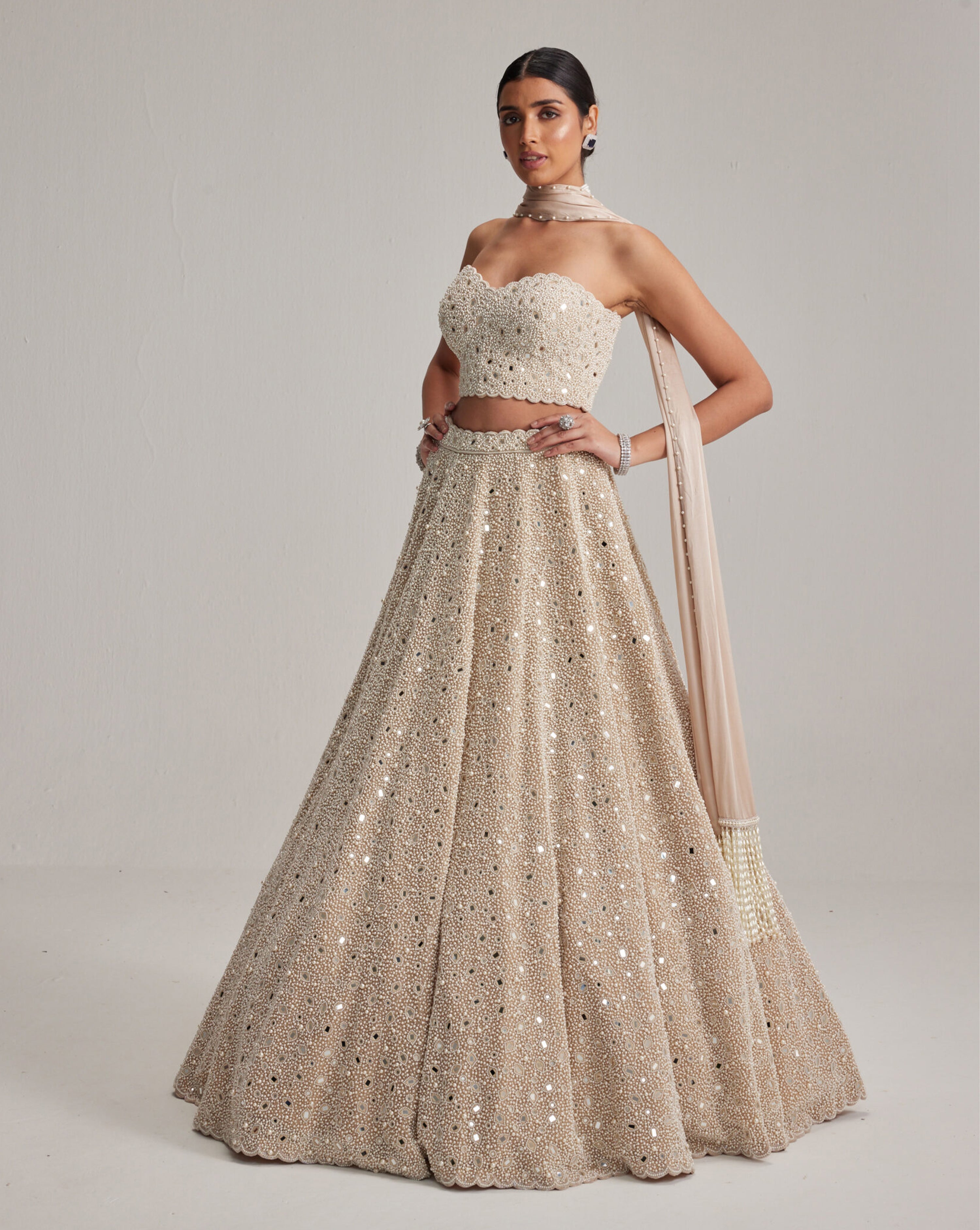 Light Beige Dense mirror and pearl Corset lehenga set With Stole