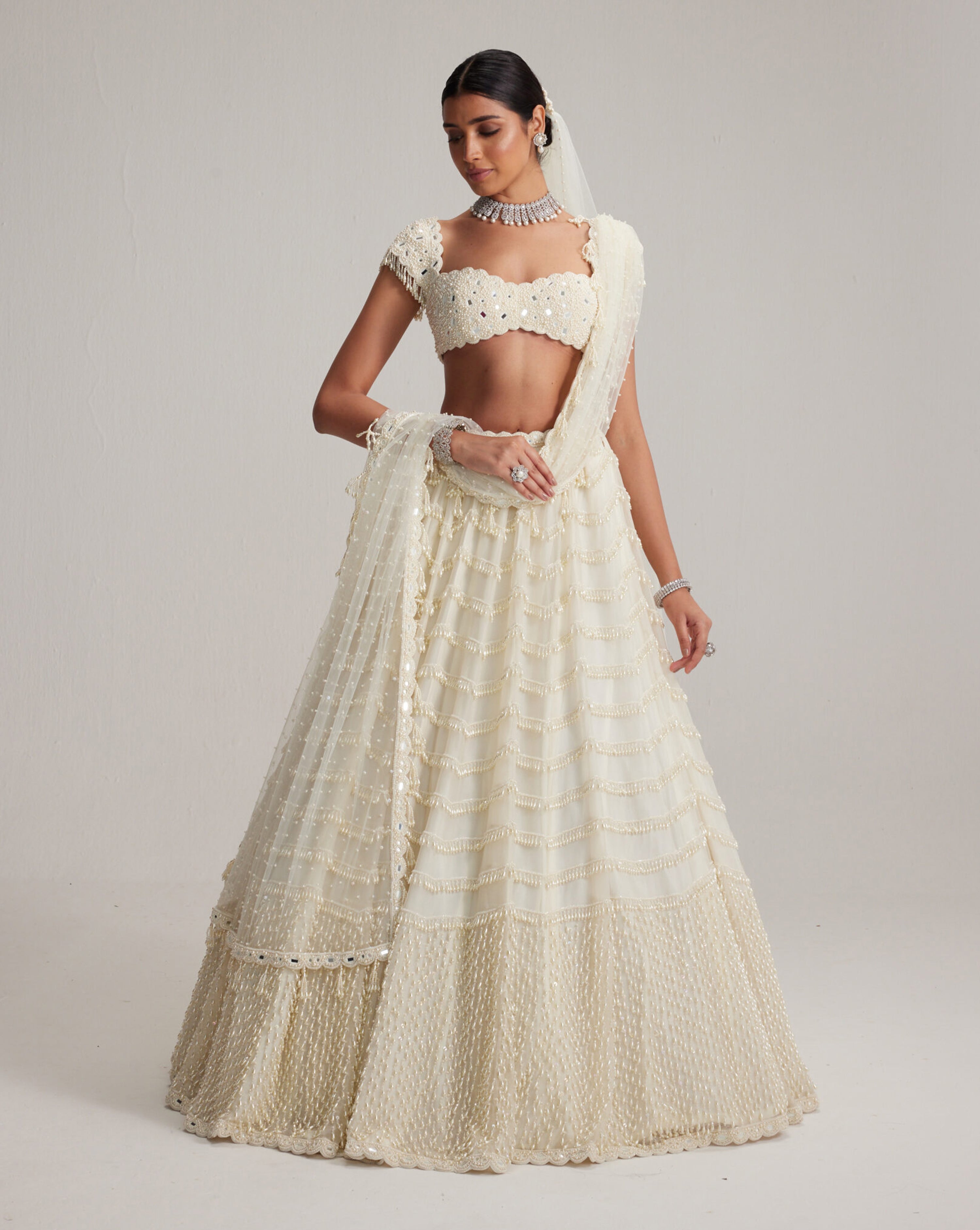 Off White Mirror and Pearl Drop Bridal lehenga set with Veil